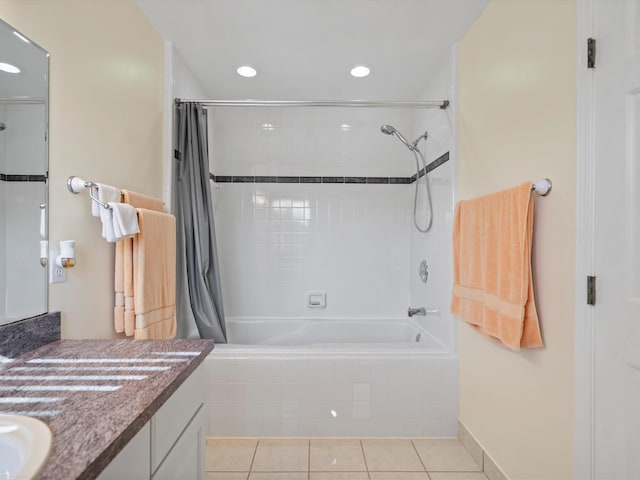 bathroom featuring vanity, shower / tub combo with curtain, and tile patterned flooring