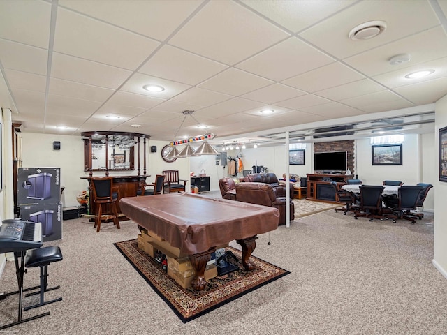 game room featuring bar area, billiards, carpet flooring, and a paneled ceiling