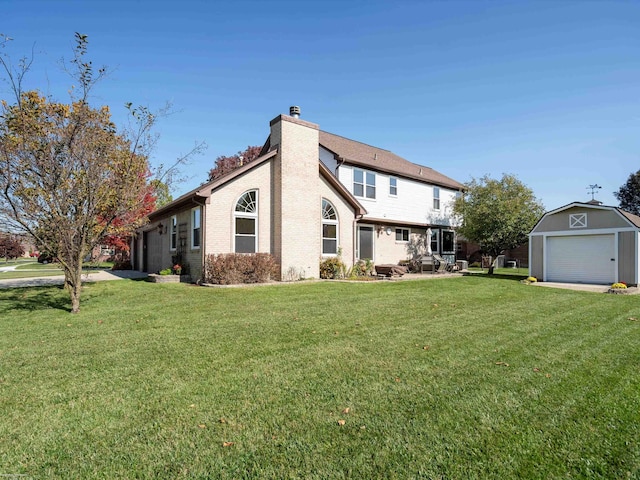 exterior space with a yard, an outdoor structure, and a garage