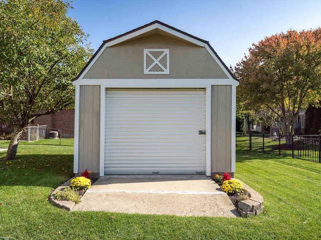 garage featuring a yard