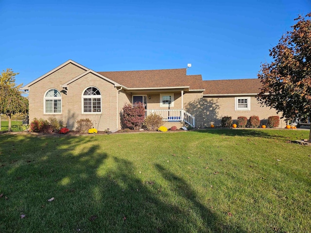 ranch-style house featuring a front lawn