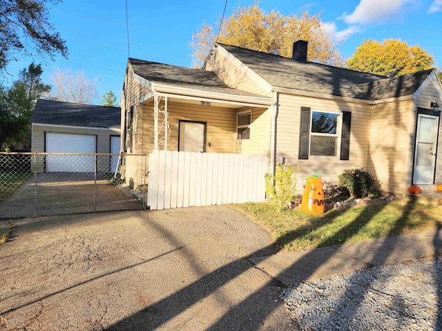 exterior space with an outbuilding and a garage