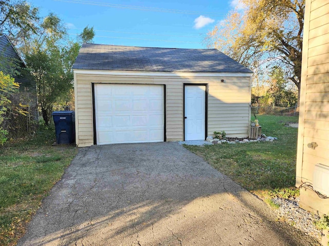 garage with a yard