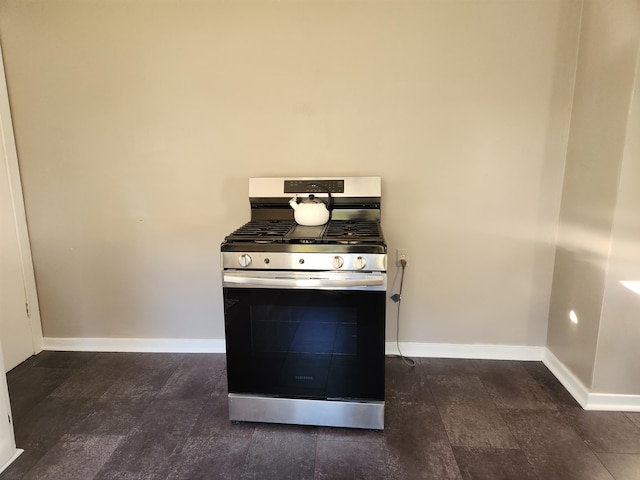 kitchen with stainless steel range with gas cooktop and dark hardwood / wood-style floors