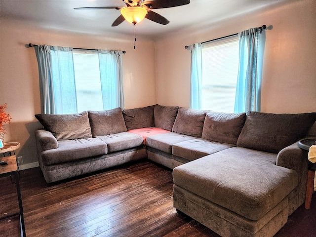 living room featuring dark hardwood / wood-style floors and ceiling fan