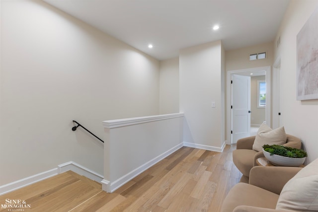 hall with light wood-type flooring