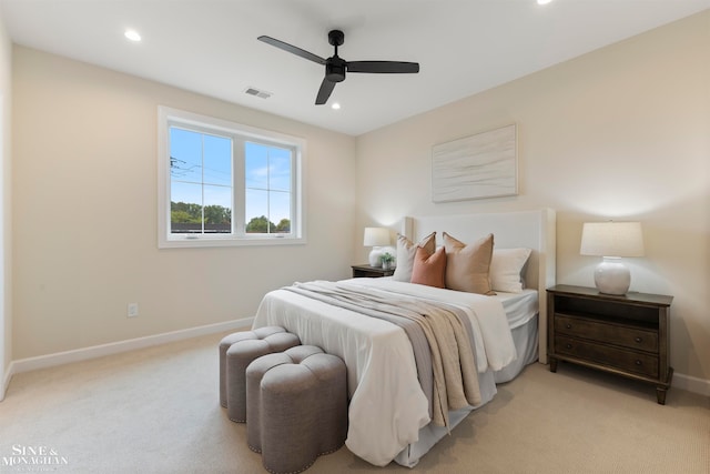 bedroom with ceiling fan and light colored carpet