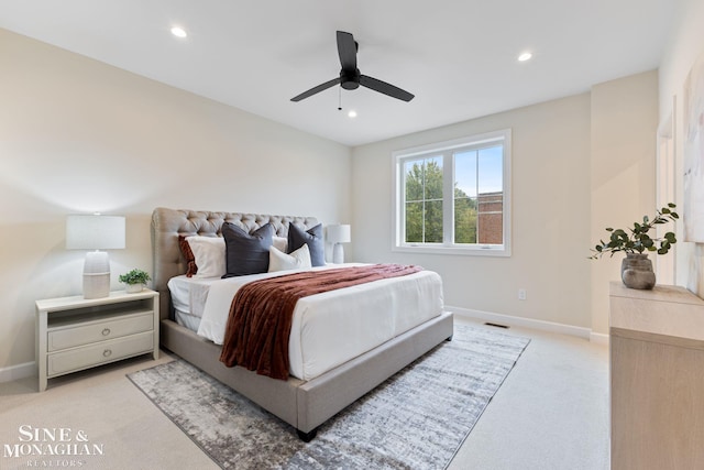 bedroom featuring ceiling fan and light carpet