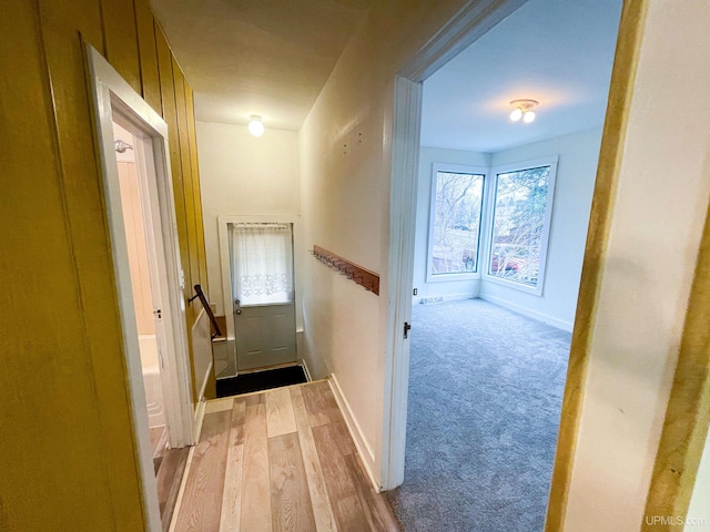 hall with light hardwood / wood-style flooring