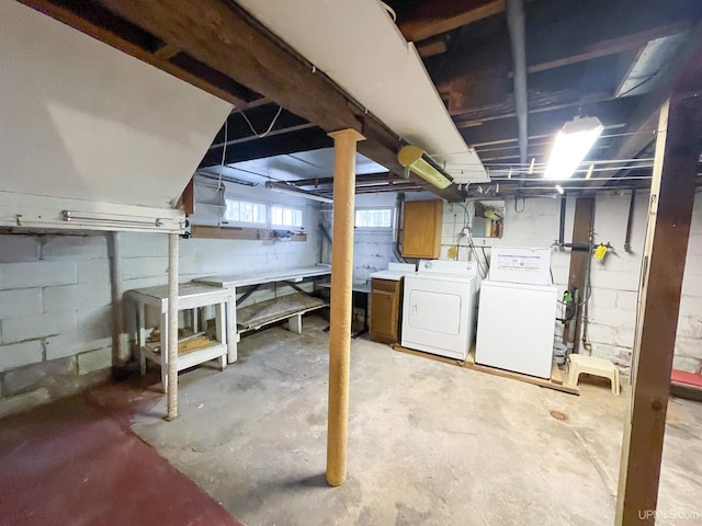 basement featuring sink and washer and clothes dryer