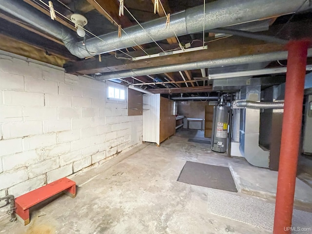 basement with gas water heater and heating unit