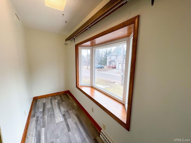 empty room with wood-type flooring