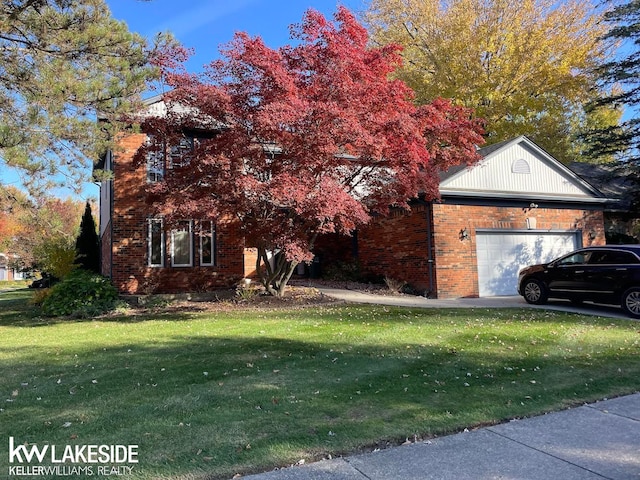 view of front facade featuring a front lawn and a garage