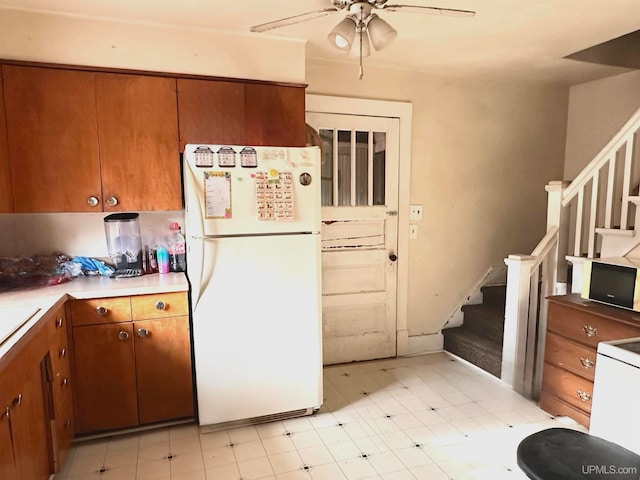 kitchen with white fridge and ceiling fan