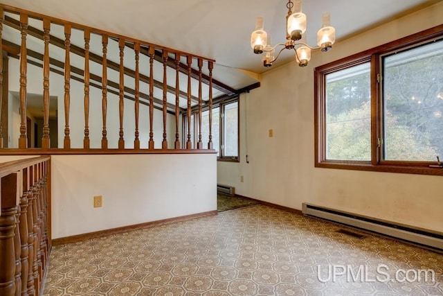 interior space featuring a notable chandelier and baseboard heating