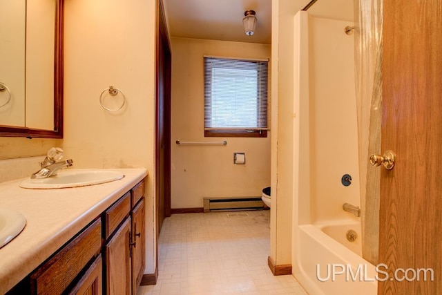 full bathroom with vanity, toilet, a baseboard radiator, and shower / tub combination