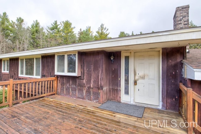 doorway to property with a wooden deck