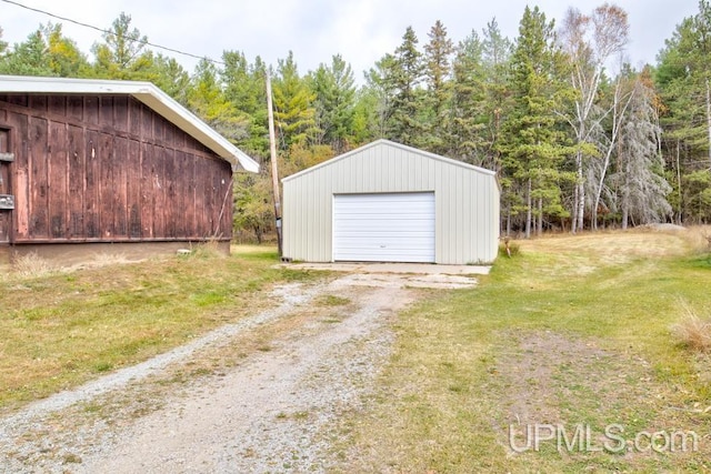 garage with a lawn