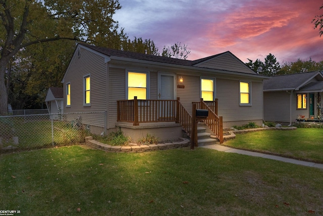 view of front of home with a yard