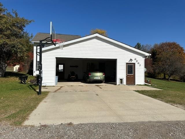 garage featuring a yard