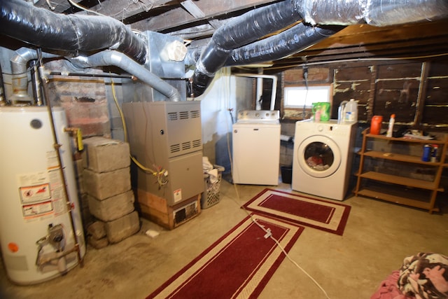 basement with washing machine and clothes dryer and gas water heater