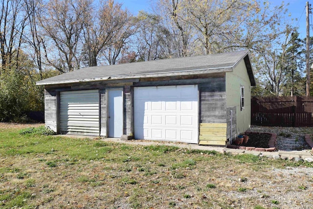 garage featuring a yard