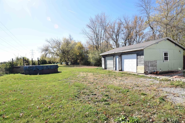 view of yard with a garage