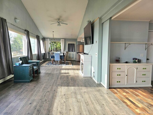 interior space with ceiling fan and lofted ceiling