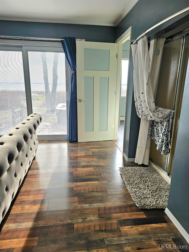 interior space with dark hardwood / wood-style floors and a baseboard heating unit