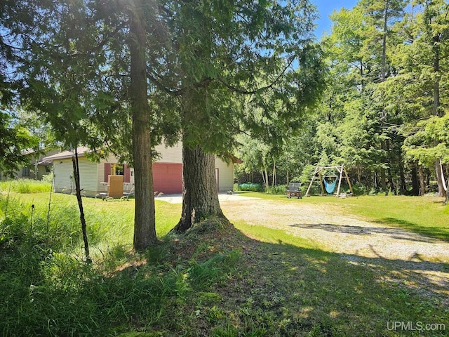 view of yard with a garage