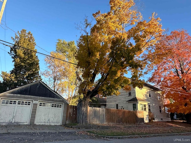 view of side of home featuring a garage