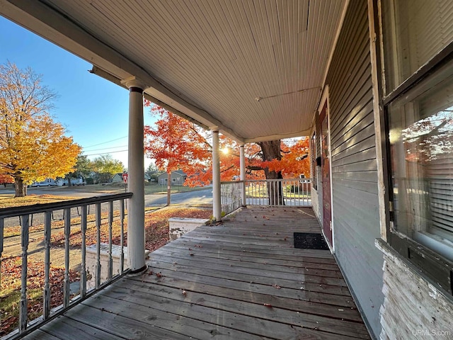 wooden terrace featuring covered porch