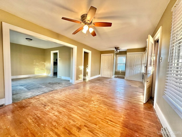 interior space featuring hardwood / wood-style flooring and ceiling fan