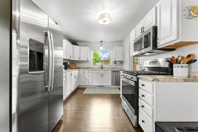 kitchen featuring white cabinets, stainless steel appliances, sink, and dark hardwood / wood-style flooring