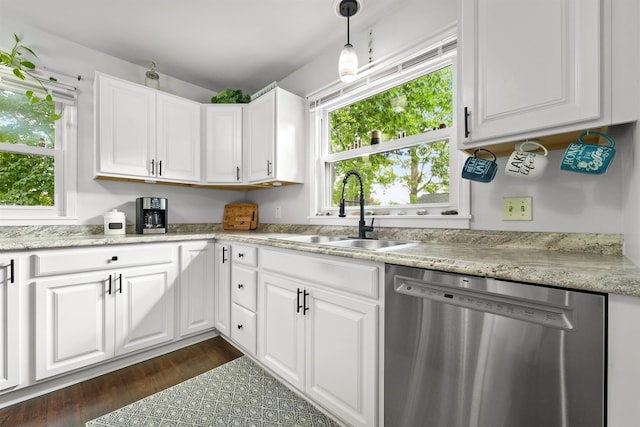 kitchen featuring sink, dishwasher, dark hardwood / wood-style flooring, white cabinetry, and pendant lighting