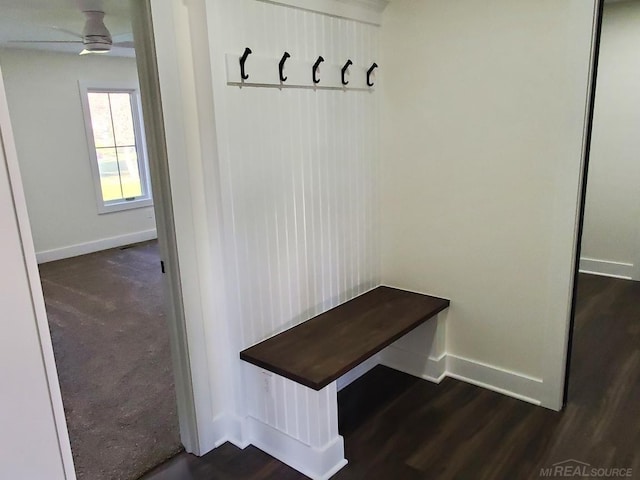 mudroom featuring dark wood-type flooring and ceiling fan