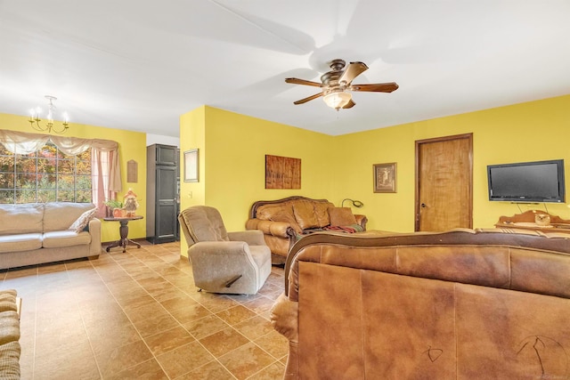 living room featuring ceiling fan with notable chandelier