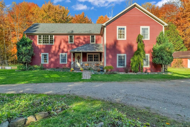 view of front of house with a front lawn and covered porch