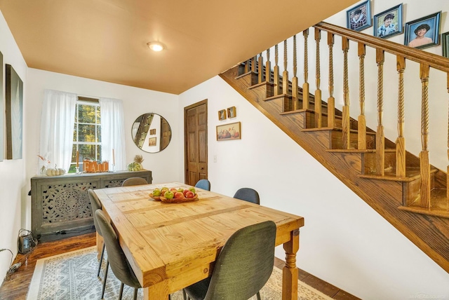 dining room with wood-type flooring