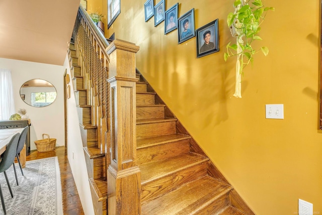 stairway featuring hardwood / wood-style flooring