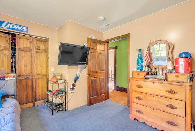 bedroom featuring light colored carpet