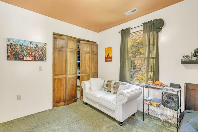 sitting room featuring carpet flooring