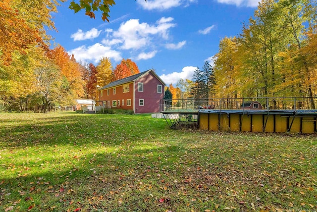 view of yard with a fenced in pool