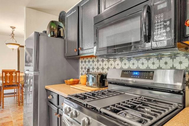 kitchen with backsplash and stainless steel range with gas cooktop