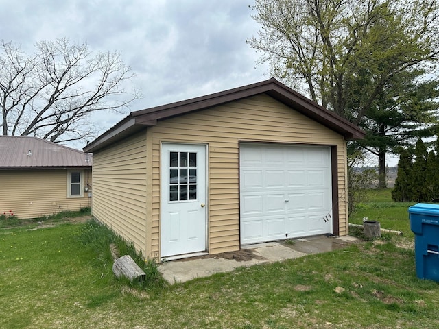 garage with a lawn