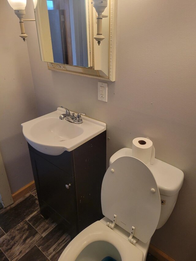 bathroom with vanity and toilet