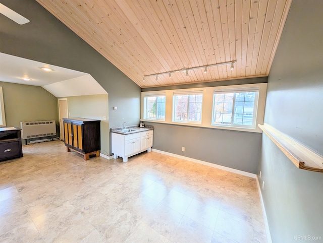 bonus room with sink, vaulted ceiling, wood ceiling, and heating unit