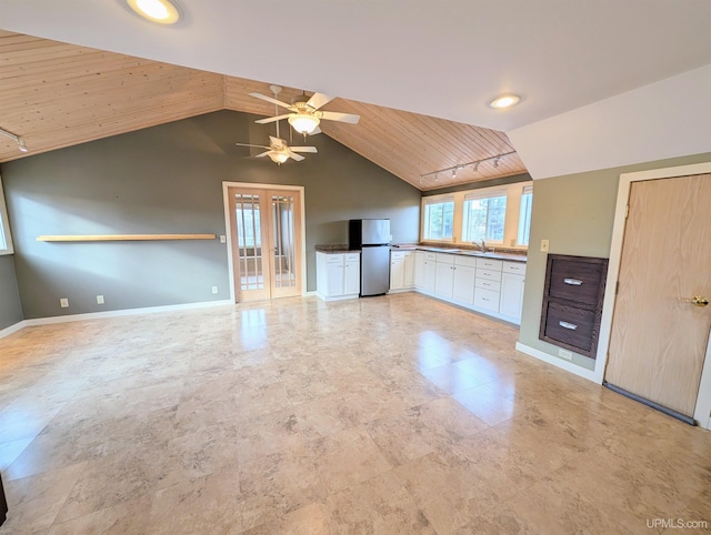 interior space featuring lofted ceiling, sink, wood ceiling, and ceiling fan