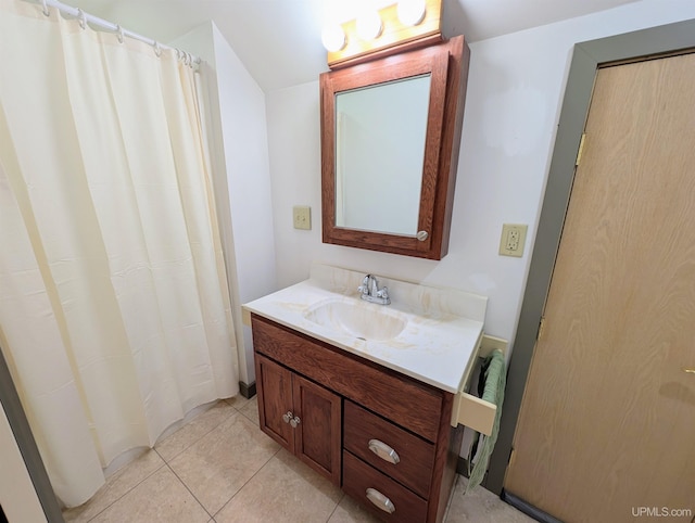 bathroom featuring vanity, curtained shower, and tile patterned flooring