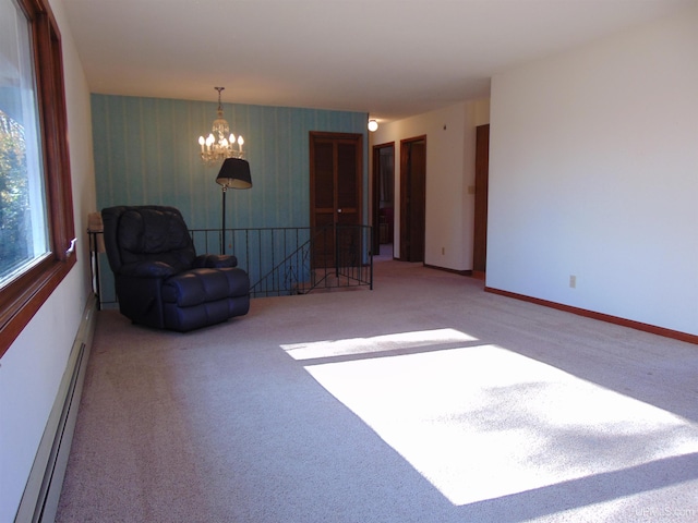 unfurnished room with light carpet, a baseboard radiator, and a chandelier